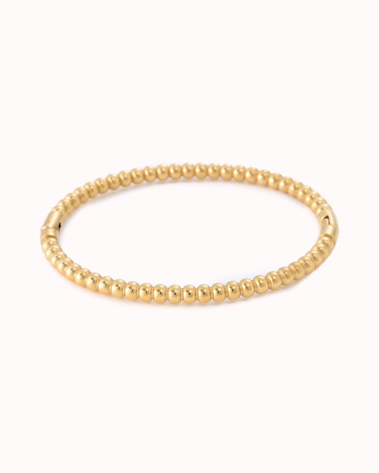 Goudkleurige bangle met balletjes effect - Nouka