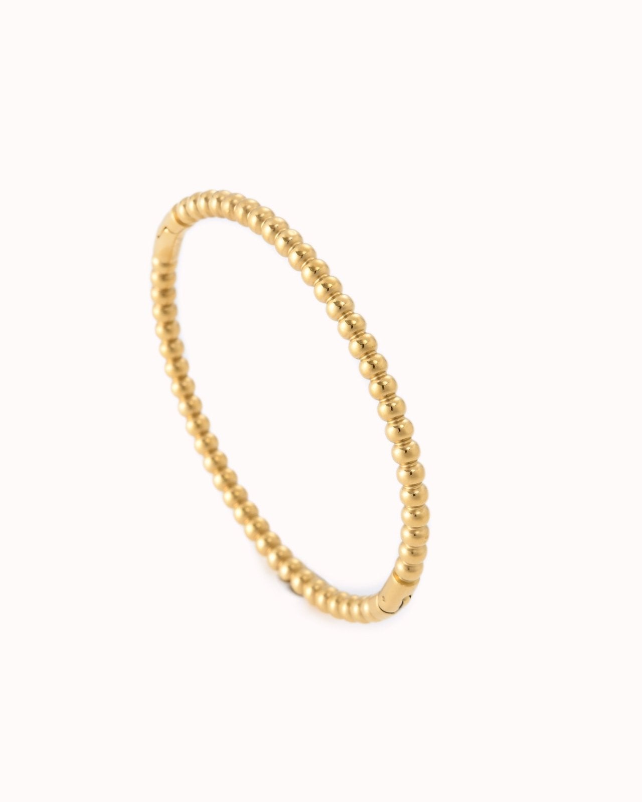 Goudkleurige bangle met balletjes effect - Nouka