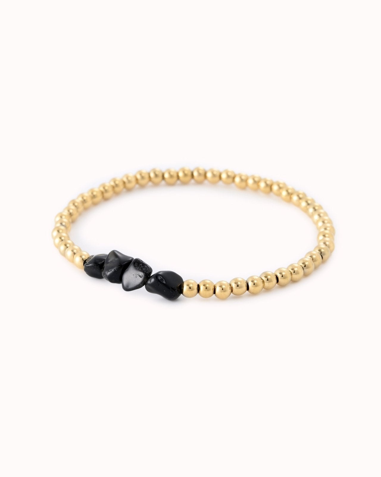 Goudkleurige kralen armband met zwarte stenen - Nouka