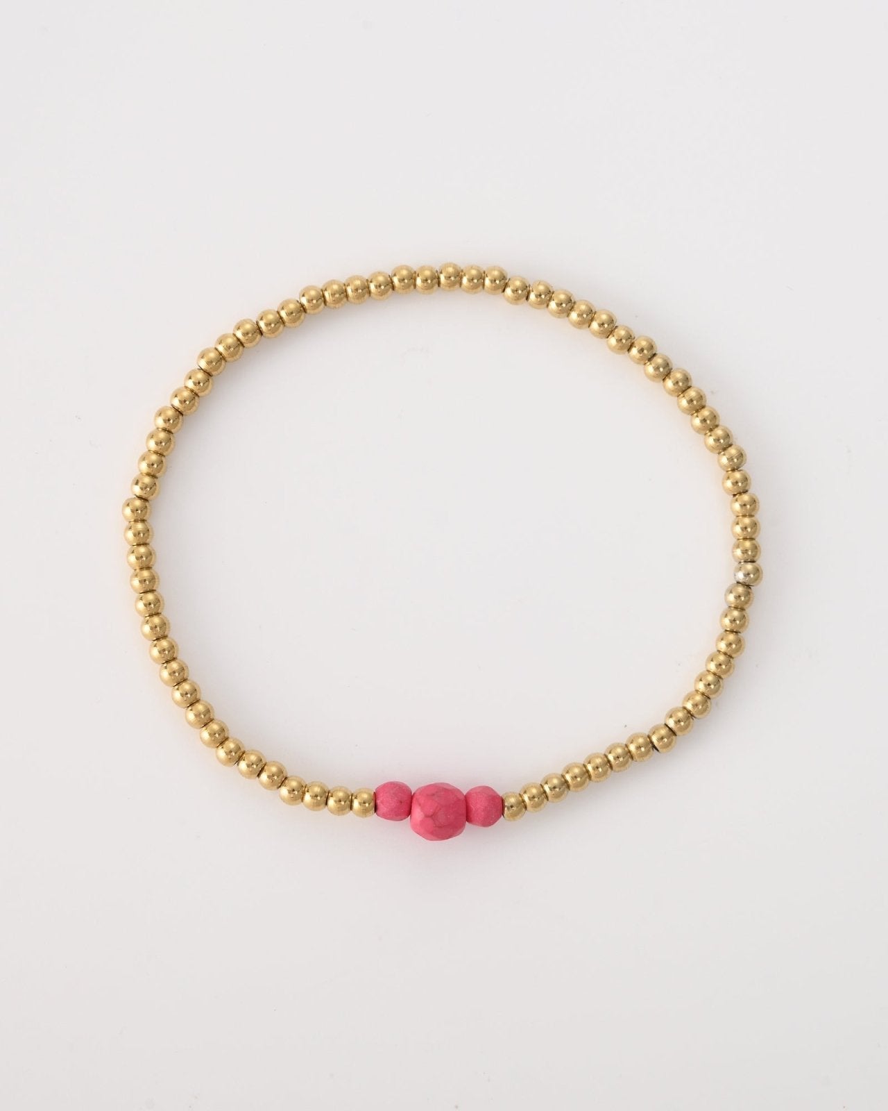 Goudkleurige armband met drie roze kralen - Nouka