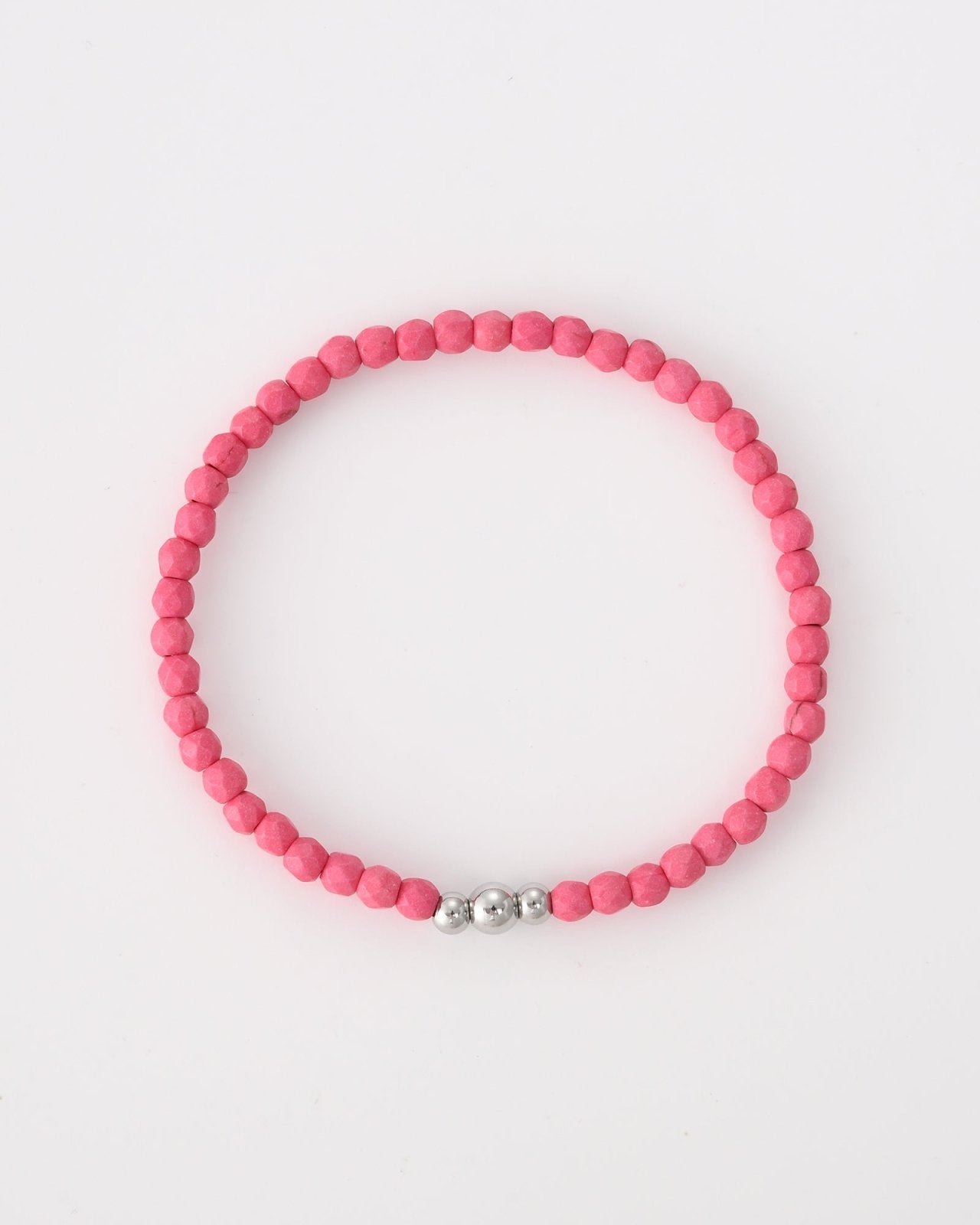 Roze kralen armband met drie zilverkleurige balletjes - Nouka