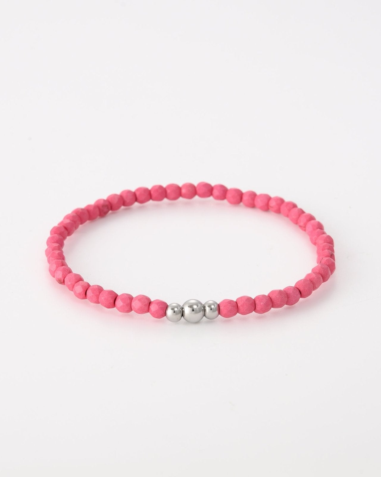 Roze kralen armband met drie zilverkleurige balletjes - Nouka