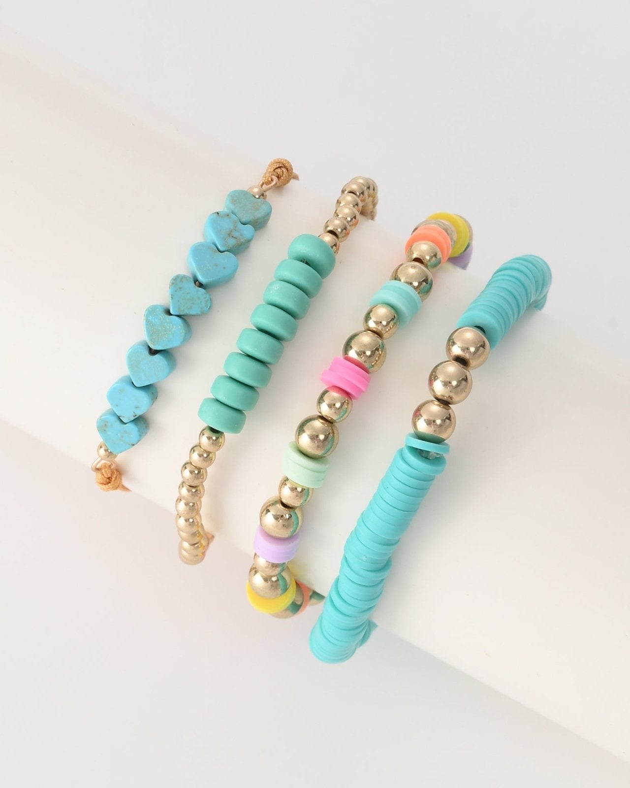 Turquoise en goudkleurige armbanden set - Nouka