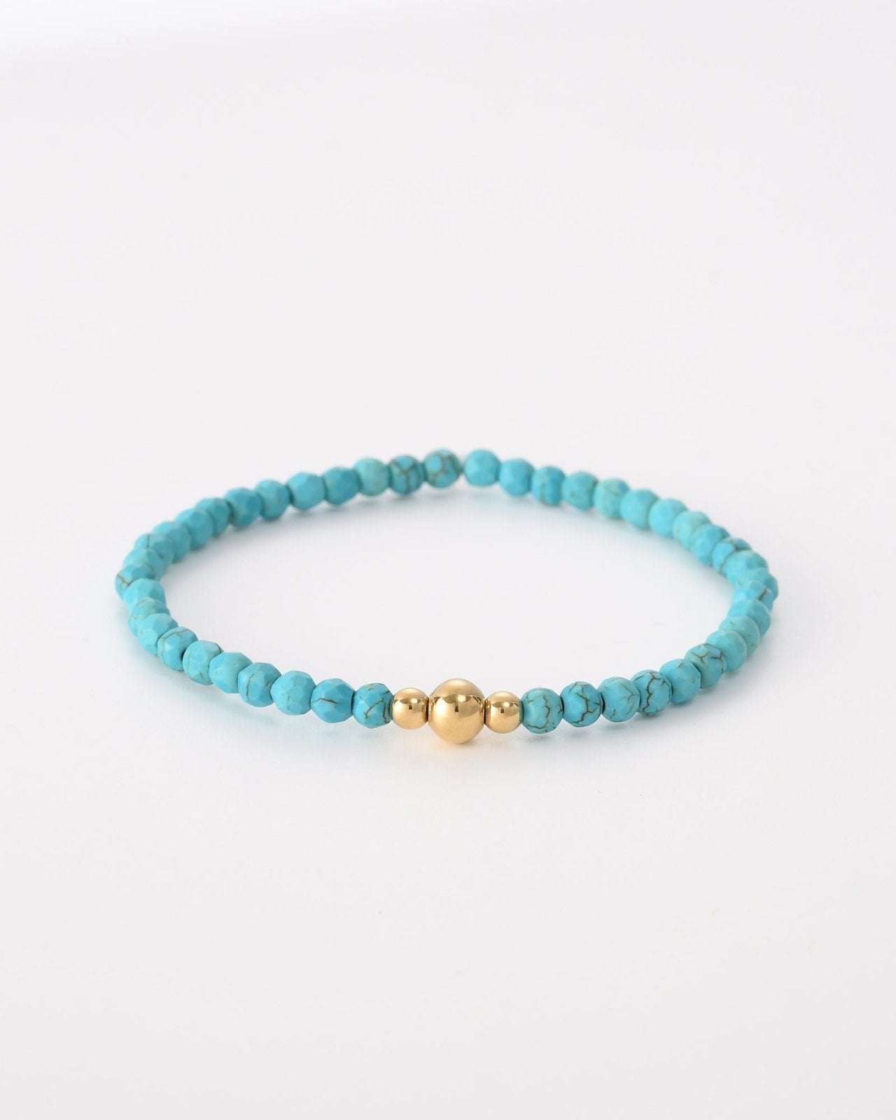 Turquoise kralen armband met drie goudkleurige balletjes - Nouka