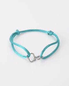 Turquoise touwtjes armband met zilverkleurige klavertjes - Nouka