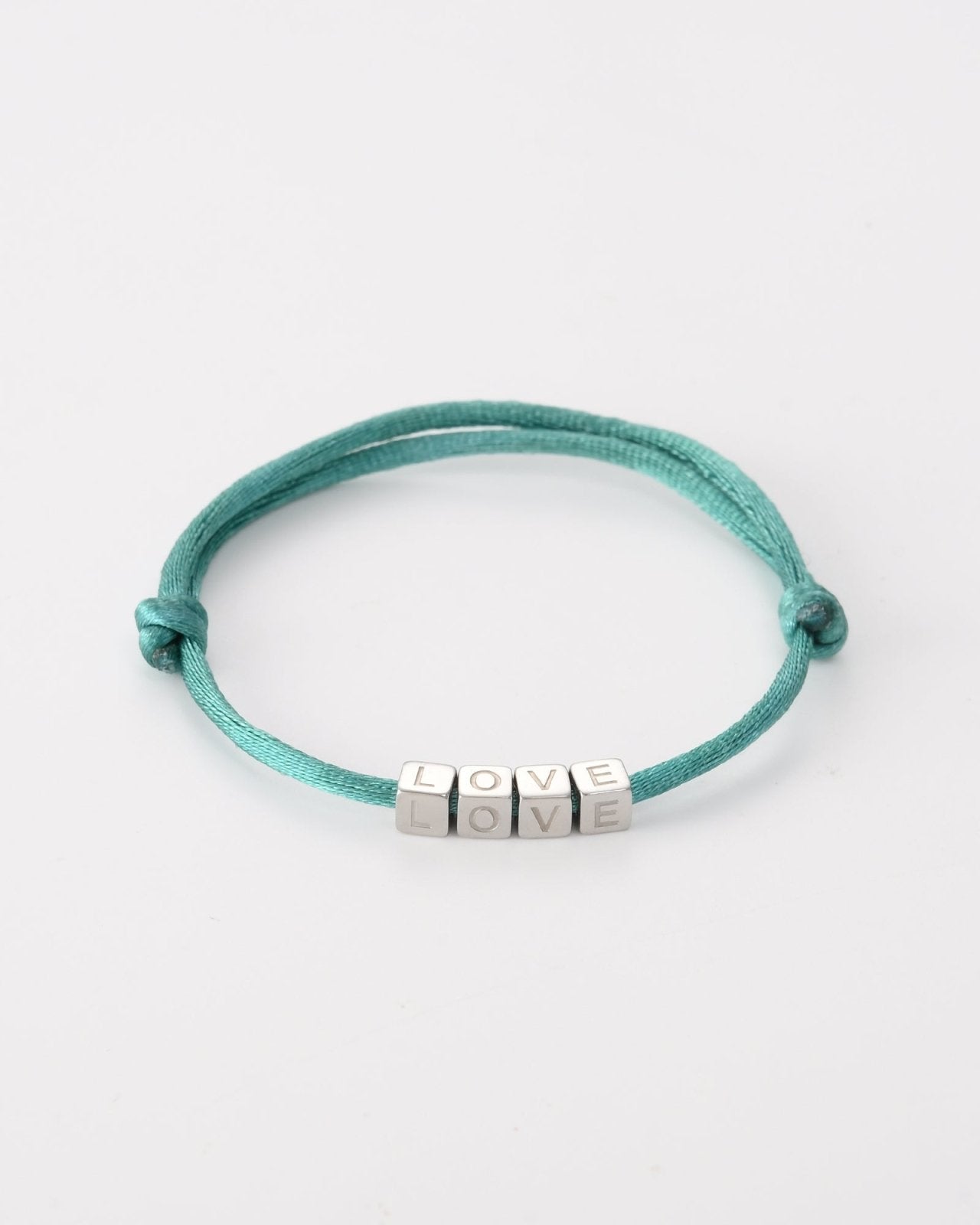 Turquoise touwtjes armband met zilverkleurige ''LOVE'' blokjes - Nouka