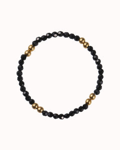 Zwarte kralen armband met goudkleurige kralen - Nouka